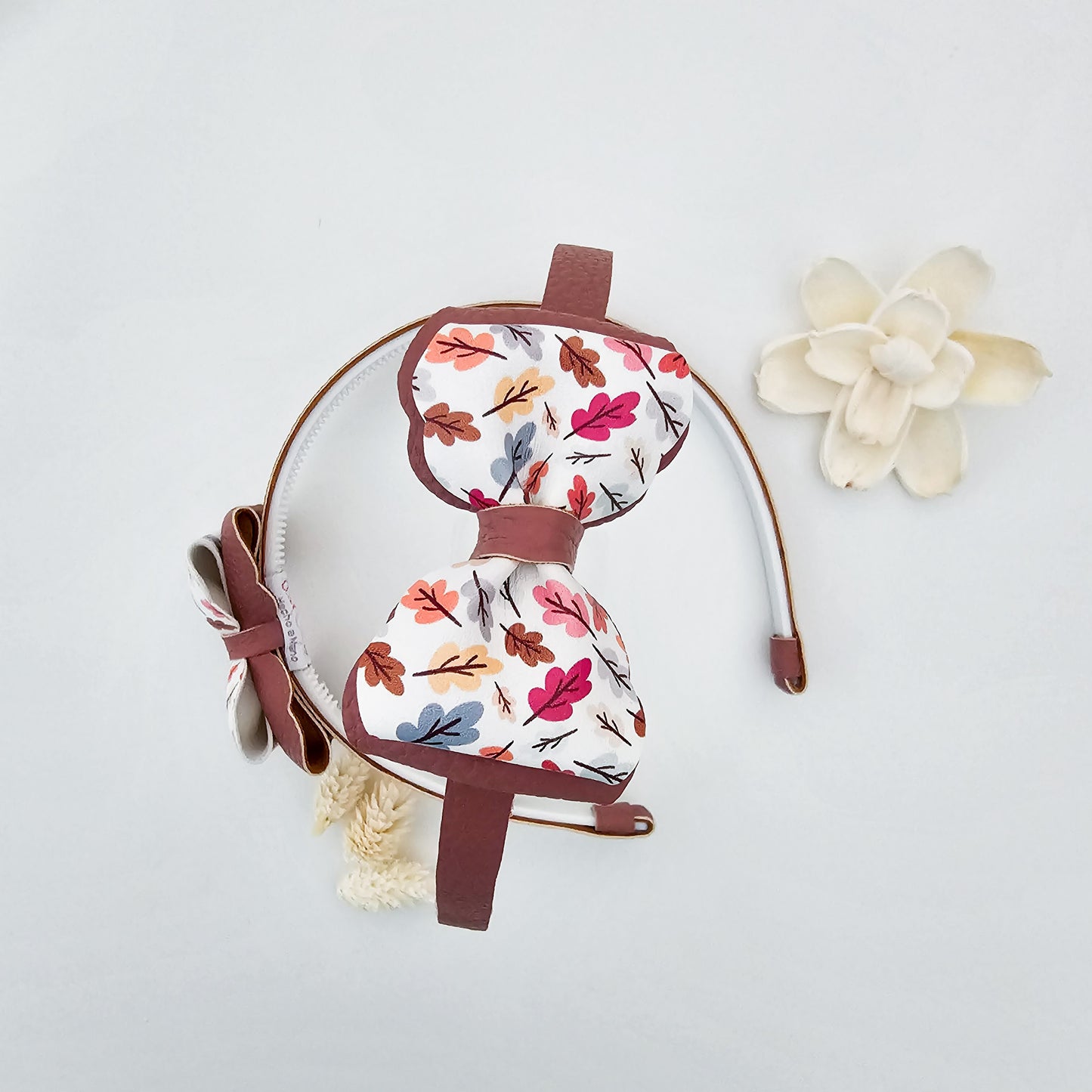 Diadema Caída de hojas rosa