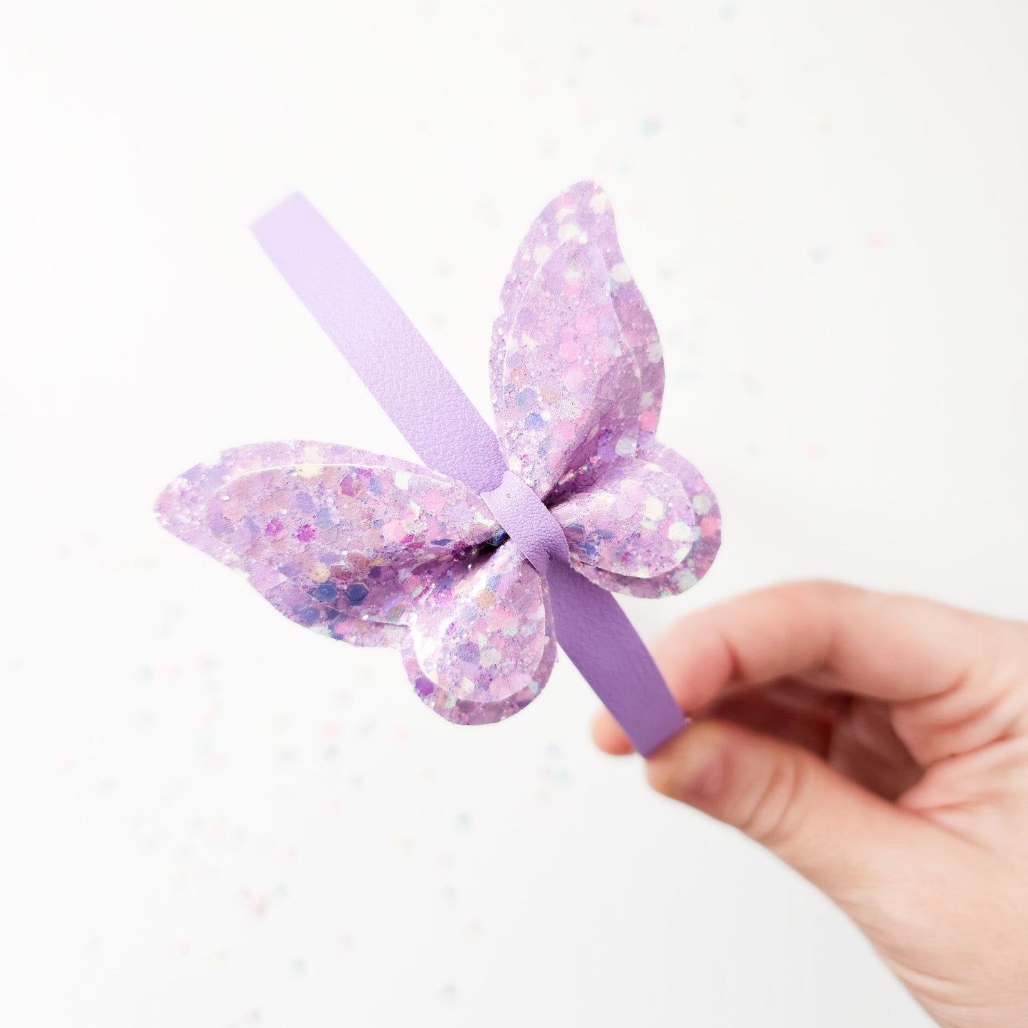 Diadema Mariposa brillo violeta