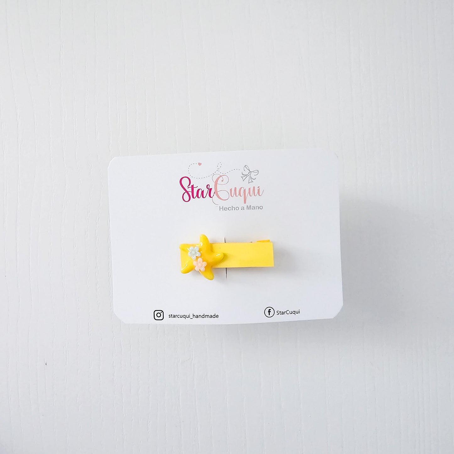Pinza estrella amarillo