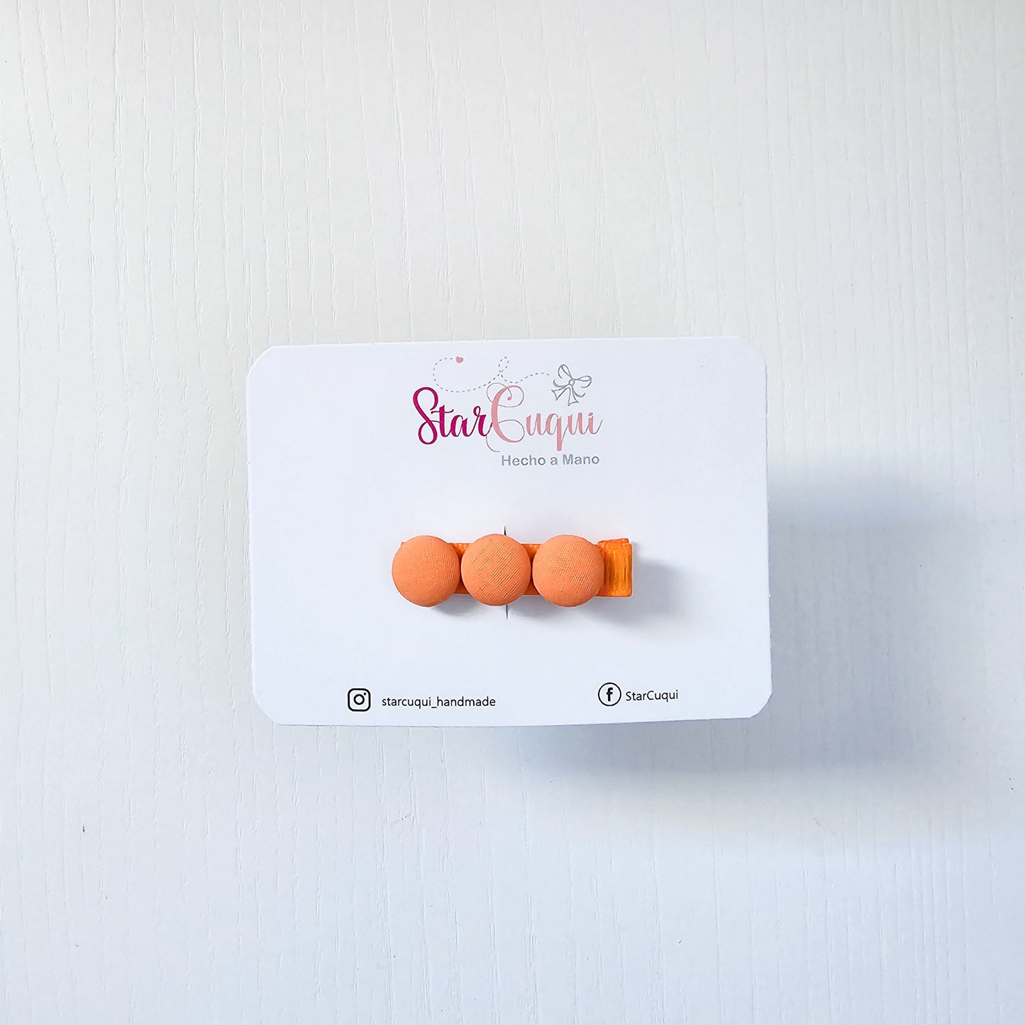 Pinza botón naranja