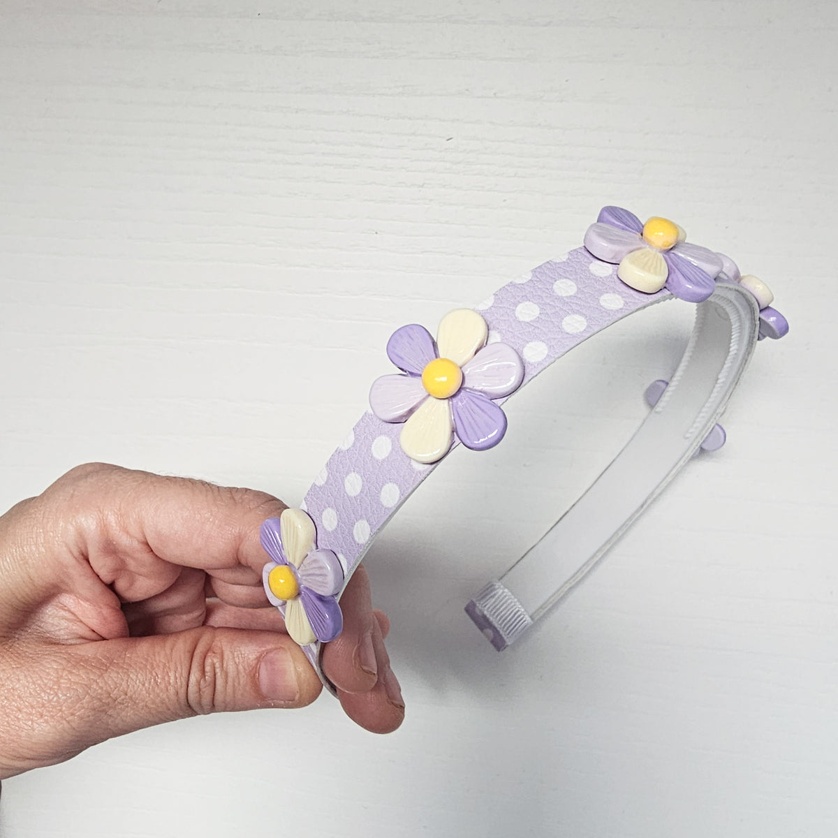 Diadema FLORES DE CARAMELO lila pastel