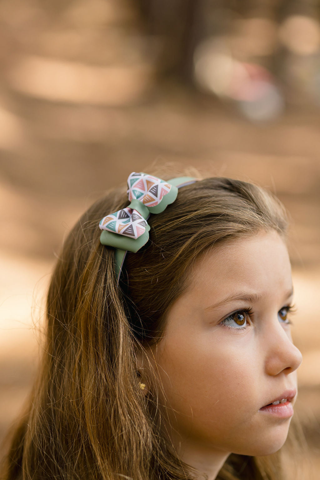 Diadema Triángulo rosa